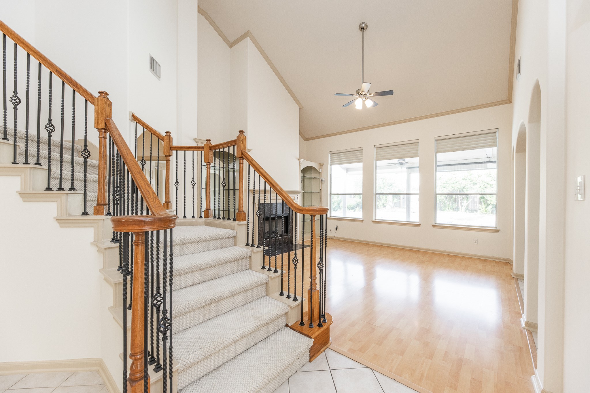 17826 Island Spring Lane Tomball, TX 77377 - Photo 16 of 47 a view of staircase with wooden floor and fan