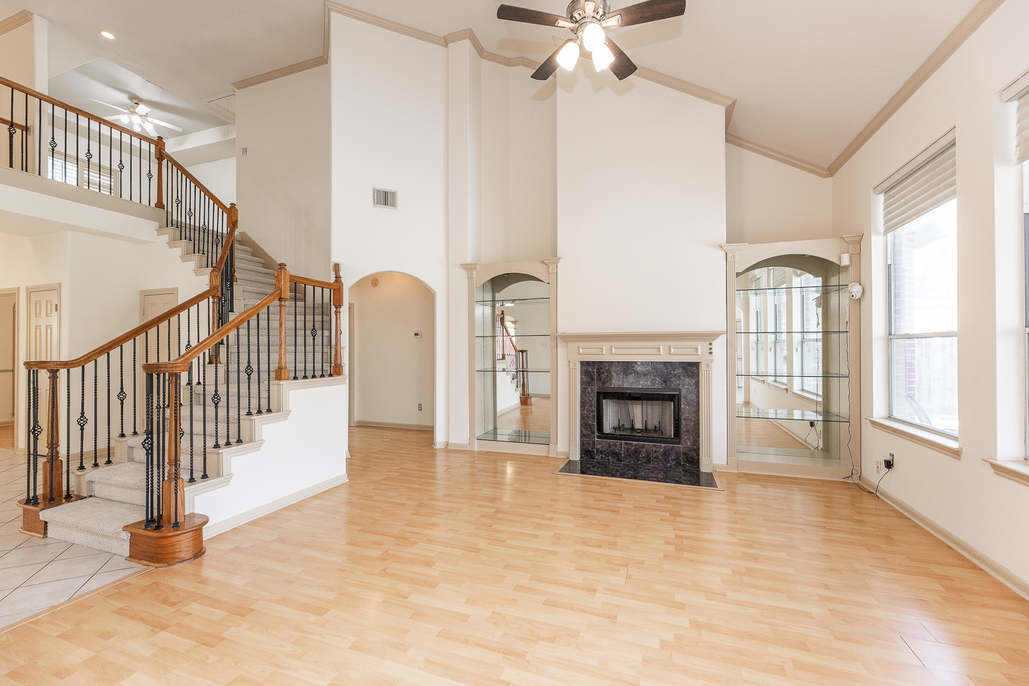 17826 Island Spring Lane Tomball, TX 77377 - Photo 17 of 47 a view of a livingroom with fireplace stairs and windows