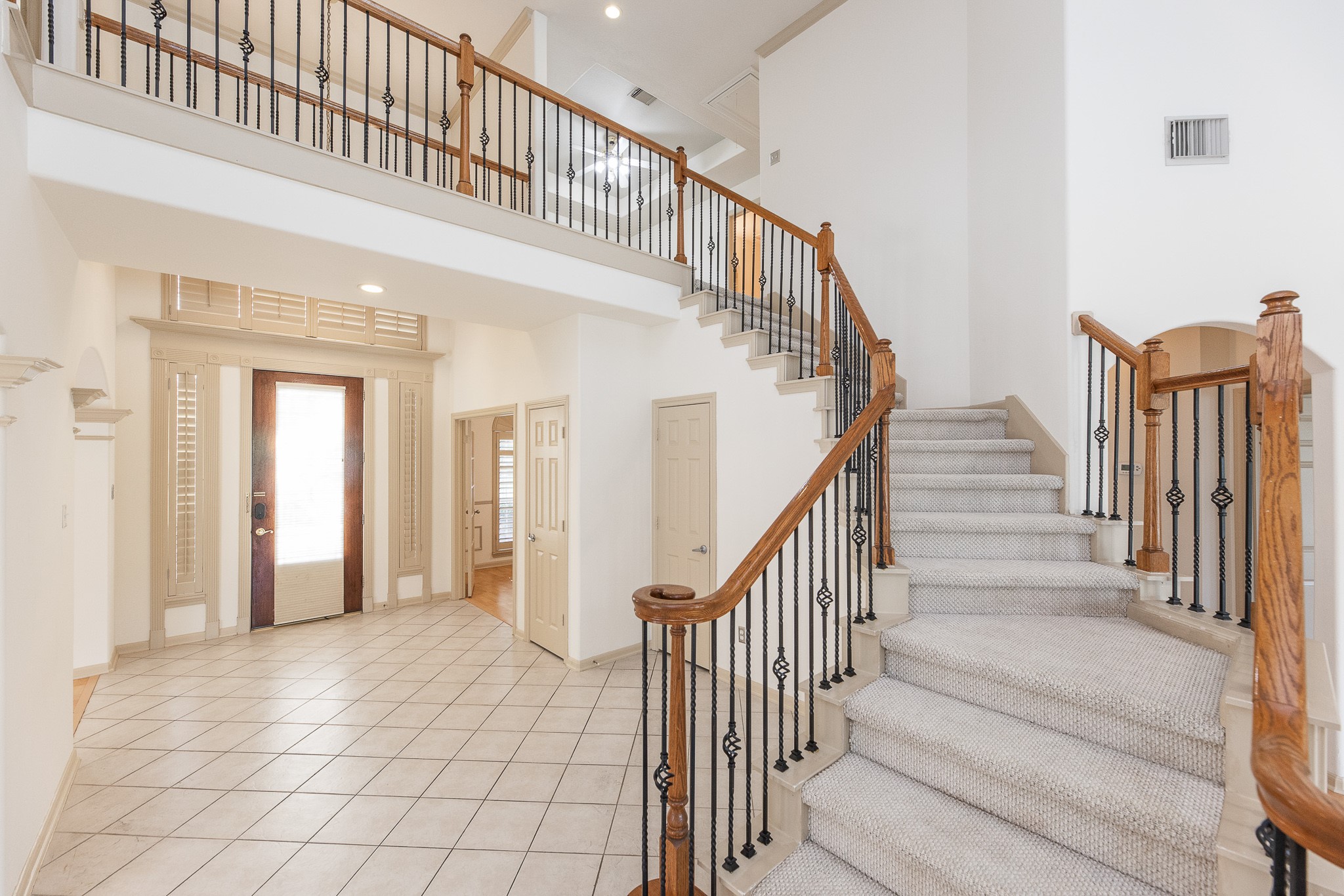 17826 Island Spring Lane Tomball, TX 77377 - Photo 34 of 47 a view of staircase with lots of frames and frames on wall