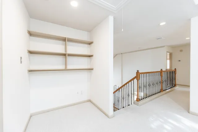 a view of a hallway with a large window