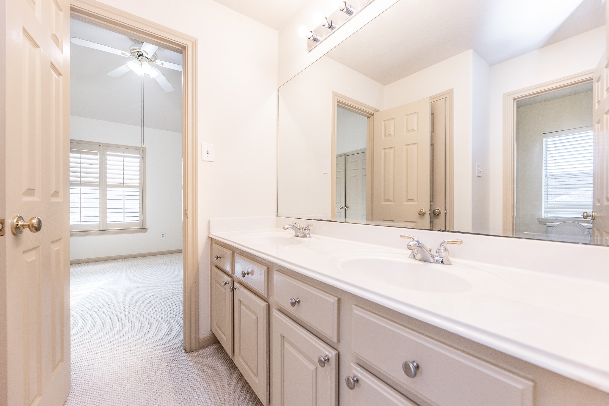 17826 Island Spring Lane Tomball, TX 77377 - Photo 43 of 47 a bathroom with a sink double vanity and a mirror