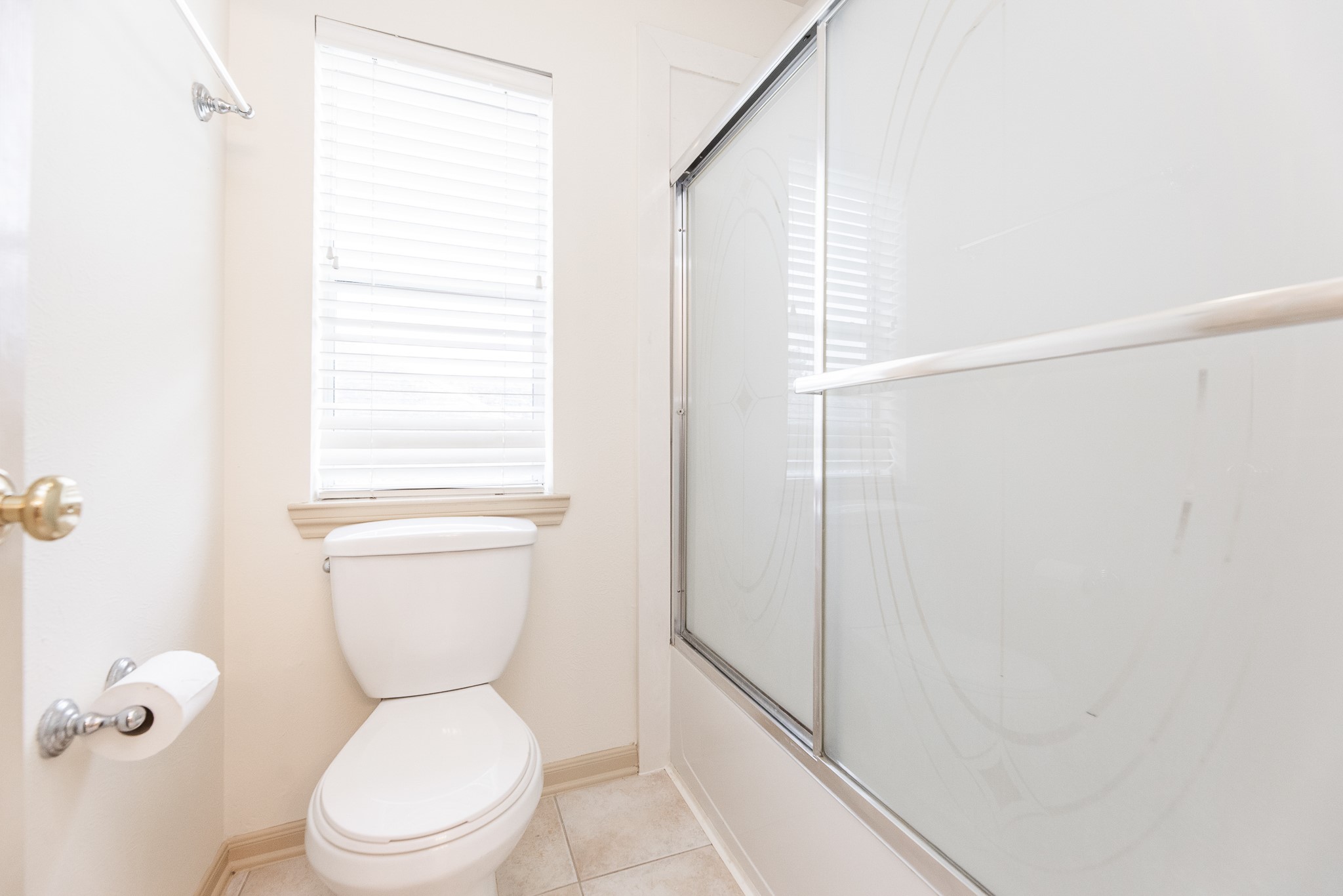 17826 Island Spring Lane Tomball, TX 77377 - Photo 44 of 47 a white toilet sitting next to a bathroom sink and a shower