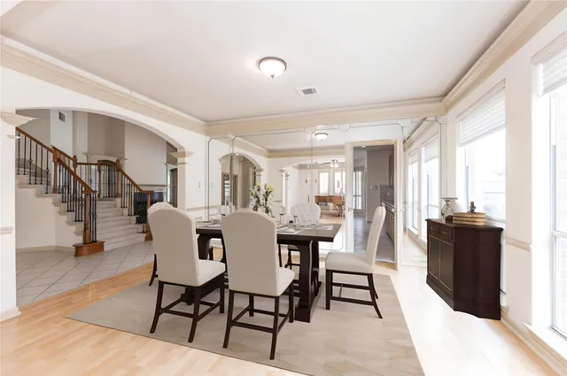 a view of a dining room with furniture window and wooden floor