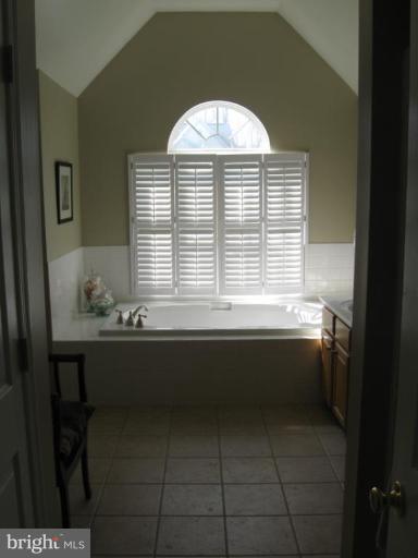 44886 Mallard Place Callaway, MD 20620 - Photo 20 of 30 a bathroom with a bathtub and a window