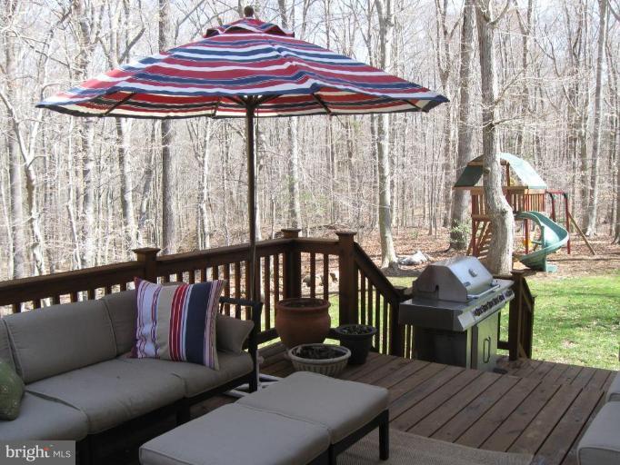 44886 Mallard Place Callaway, MD 20620 - Photo 29 of 30 a view of a deck with a table and chairs