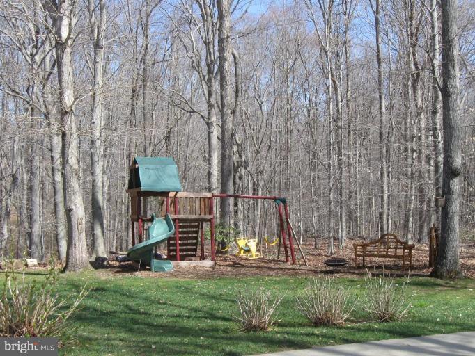 44886 Mallard Place Callaway, MD 20620 - Photo 30 of 30 a view of a park with a bench and trees