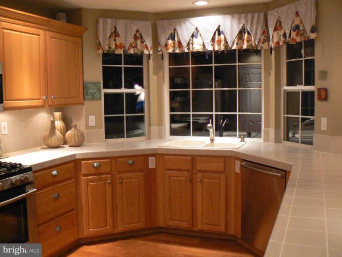 44886 Mallard Place Callaway, MD 20620 - Photo 7 of 30 a kitchen with a sink and a window