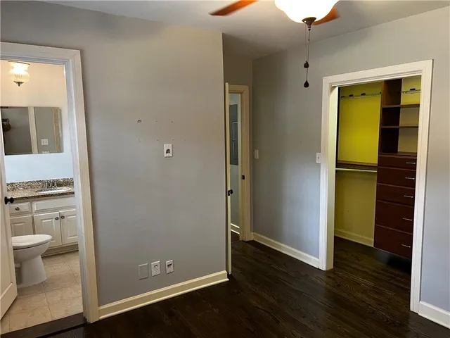 a view of bathroom with a toilet sink and a mirror