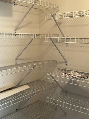 a view of a swimming pool and wooden floor