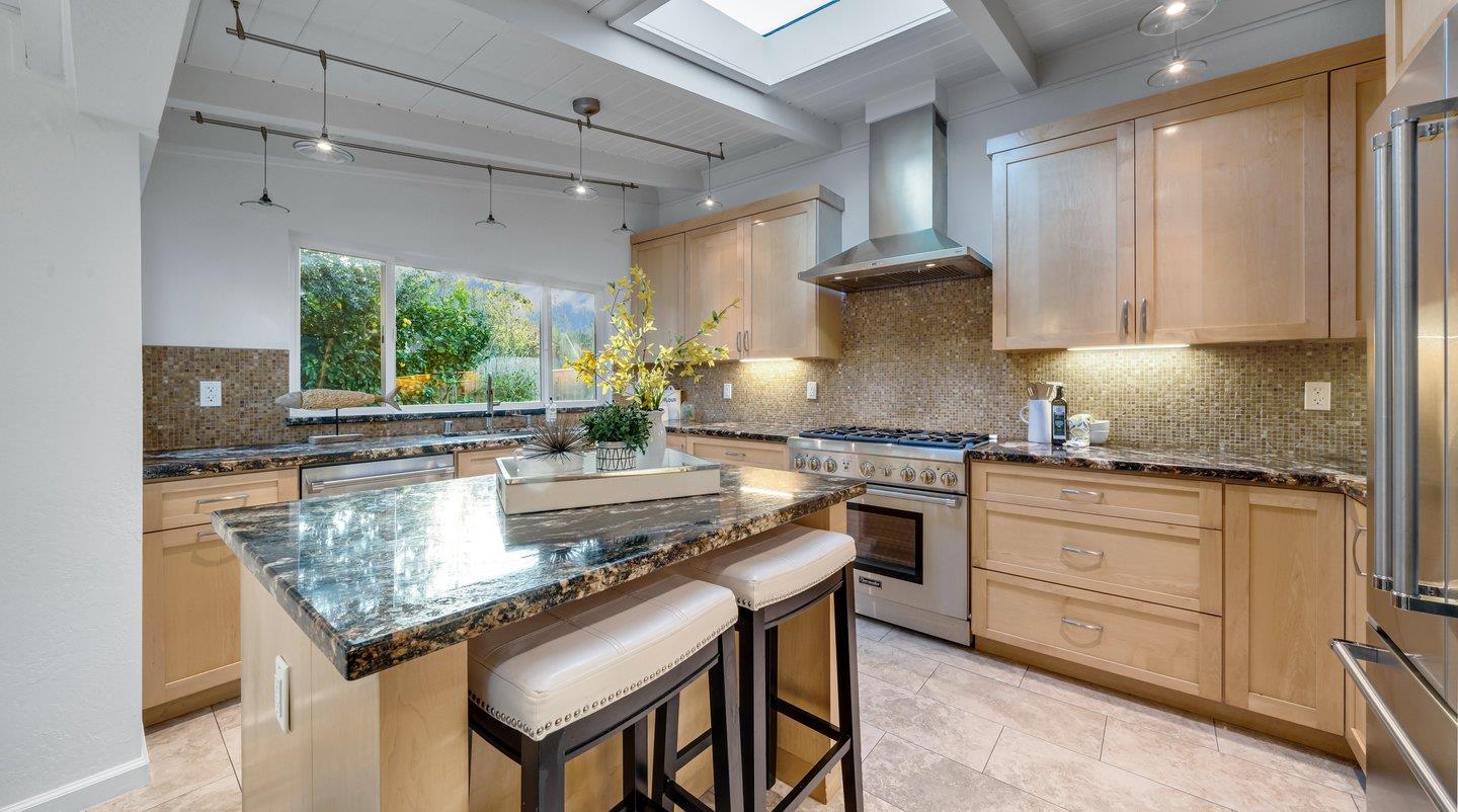 806 Rorke Way Palo Alto, CA 94303 - Photo 20 of 41 a kitchen with stainless steel appliances granite countertop a stove a sink dishwasher and cabinets with wooden floor