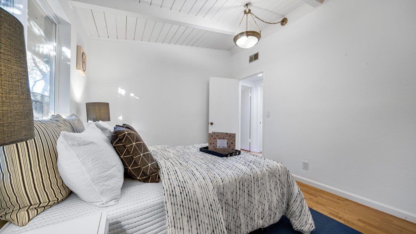 806 Rorke Way Palo Alto, CA 94303 - Photo 25 of 41 a bedroom with a bed and ceiling fan