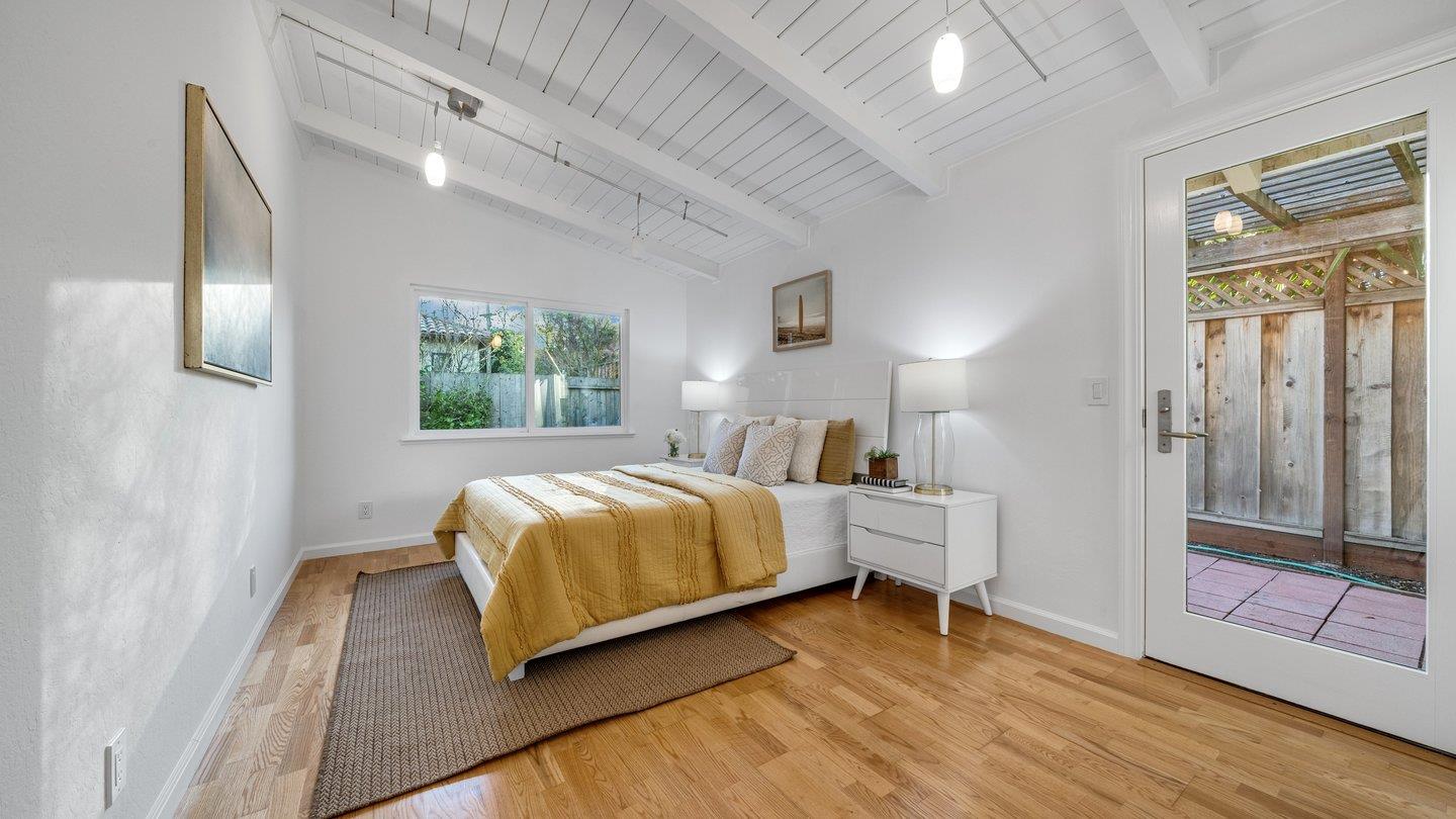 806 Rorke Way Palo Alto, CA 94303 - Photo 27 of 41 a bedroom with a bed and wooden floor