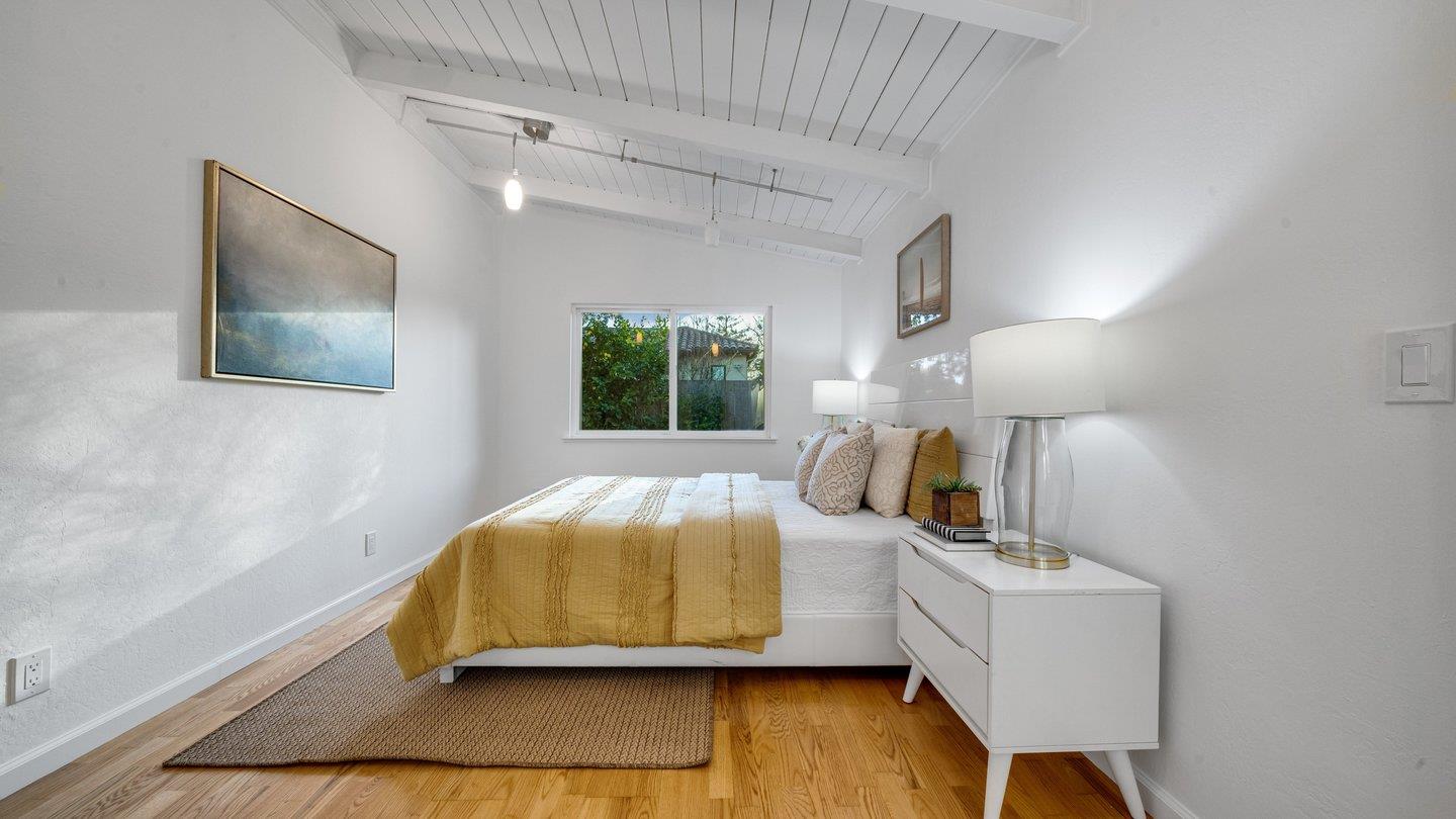 806 Rorke Way Palo Alto, CA 94303 - Photo 29 of 41 a room with a bed and a lamp