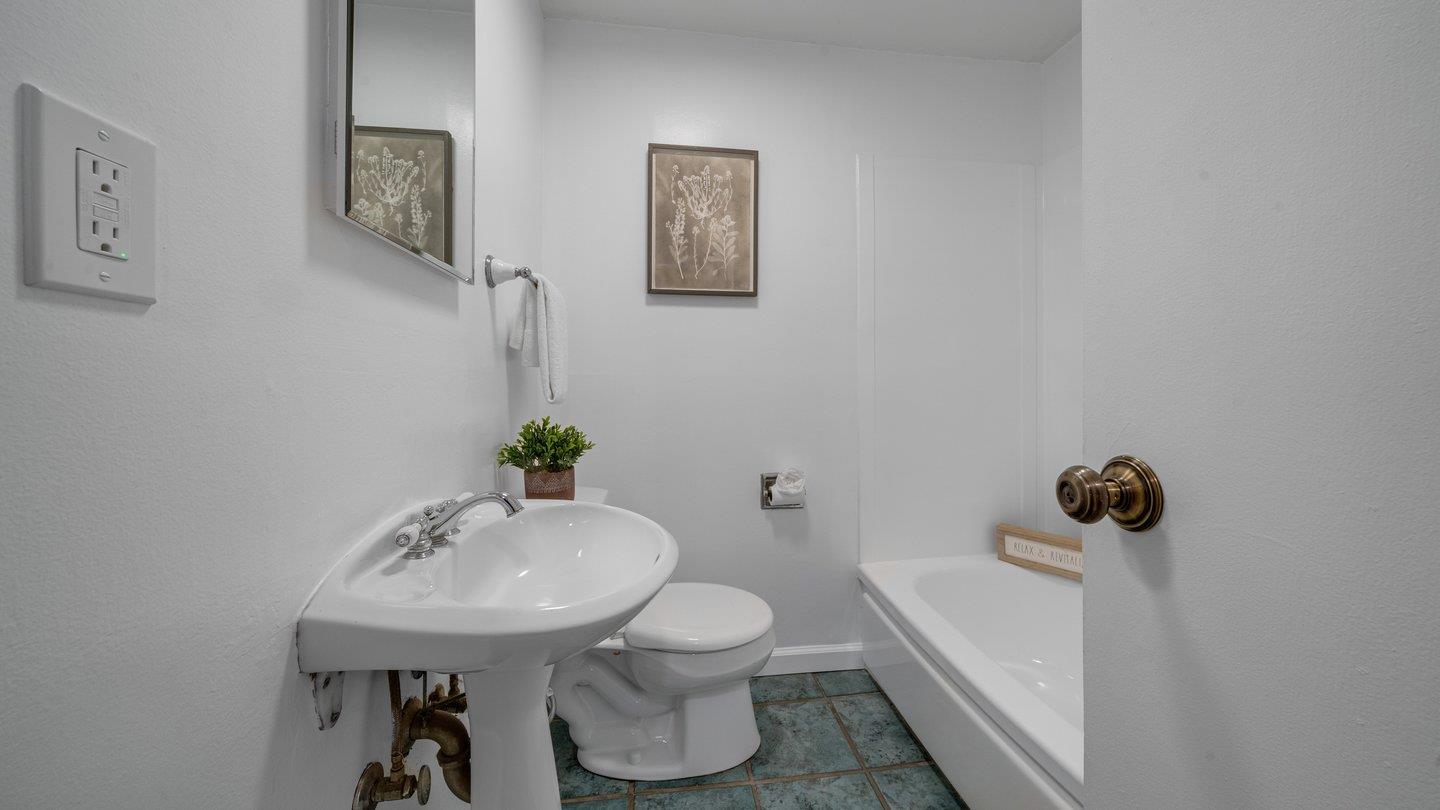 806 Rorke Way Palo Alto, CA 94303 - Photo 30 of 41 a bathroom with a sink toilet and a mirror