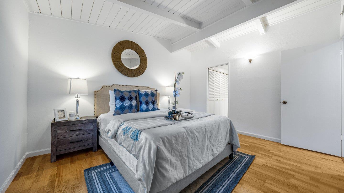 806 Rorke Way Palo Alto, CA 94303 - Photo 32 of 41 a bedroom with a bed and wooden floor