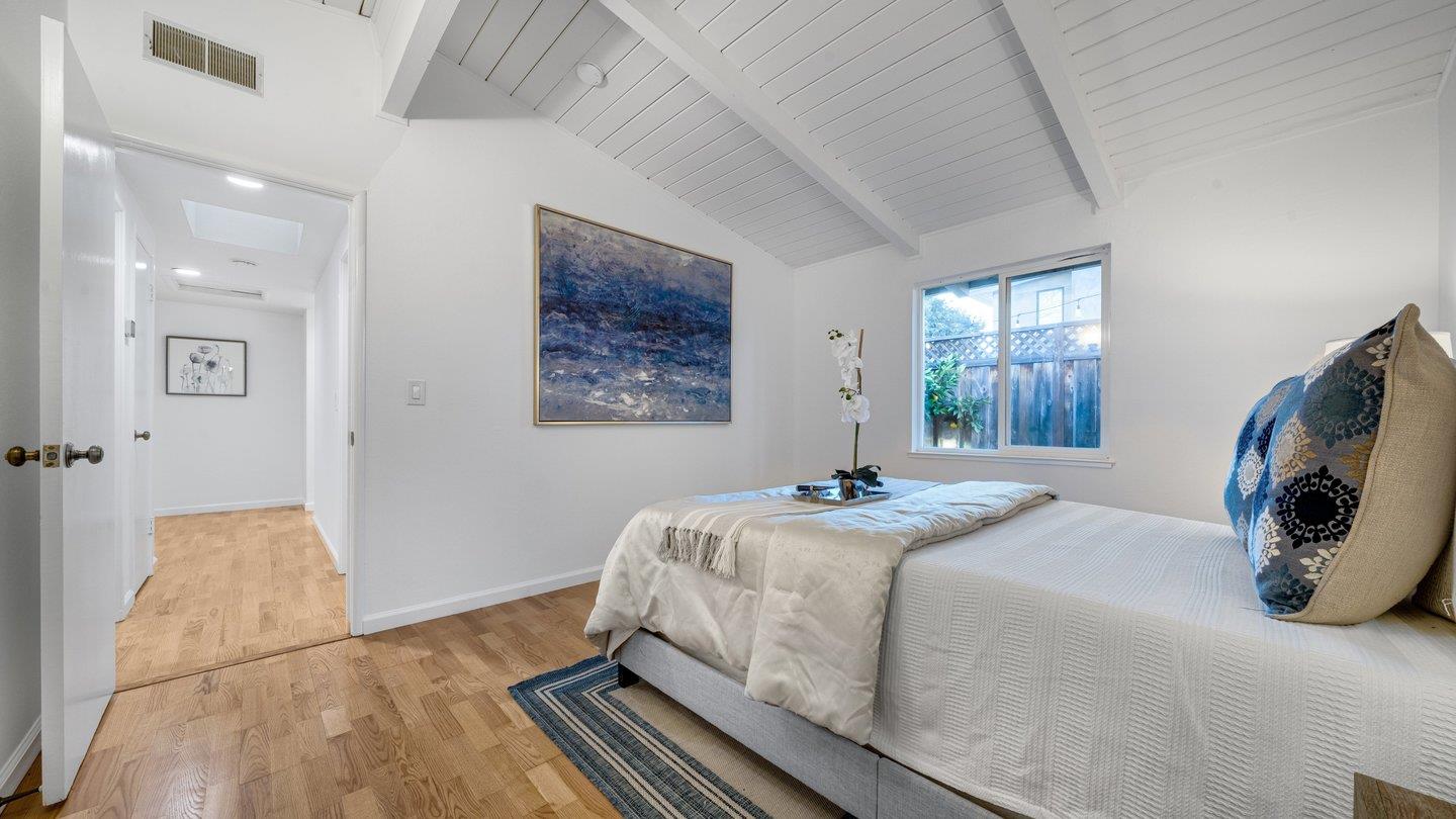 806 Rorke Way Palo Alto, CA 94303 - Photo 33 of 41 a bedroom with a bed and a flat screen tv