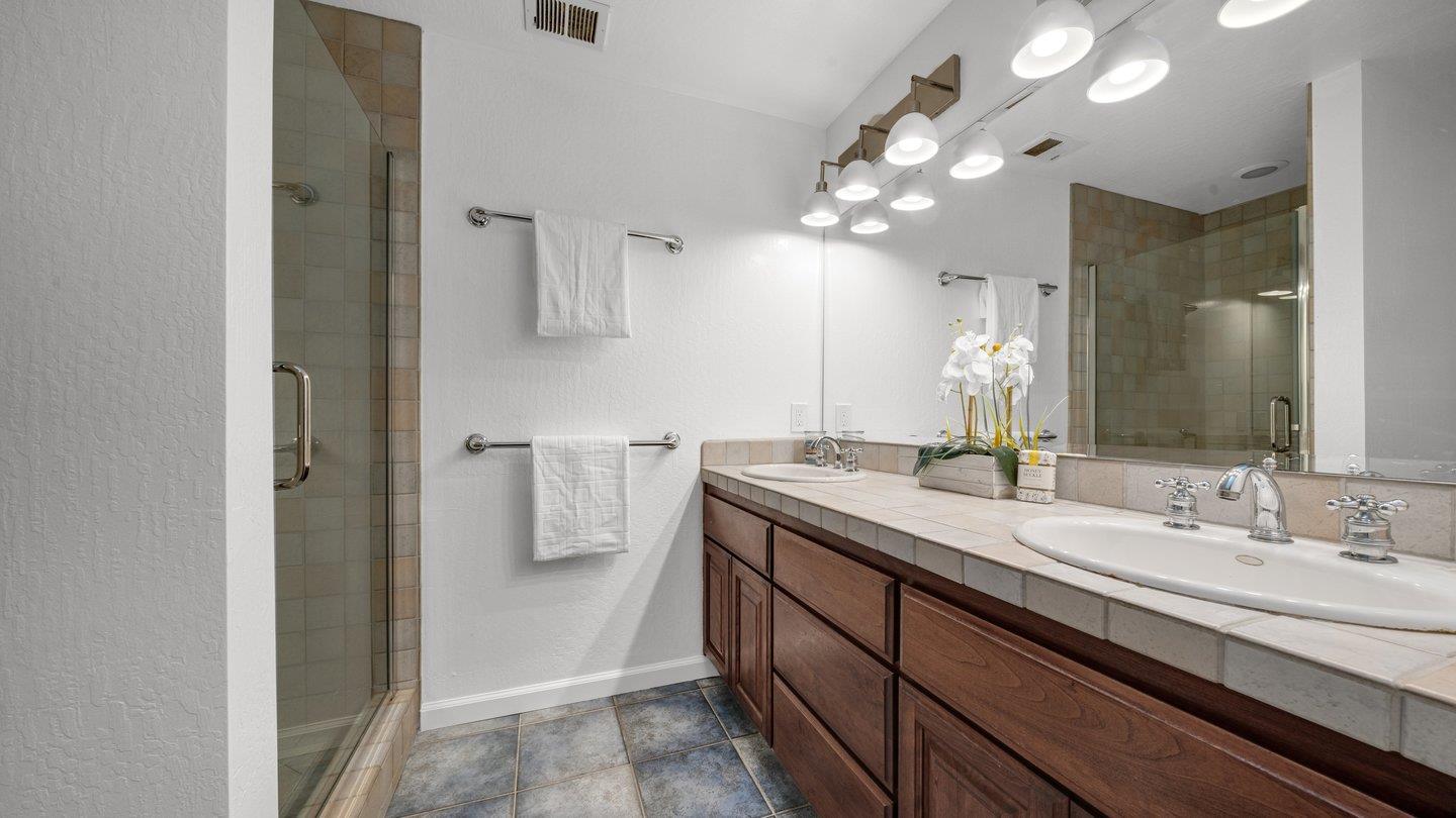 806 Rorke Way Palo Alto, CA 94303 - Photo 34 of 41 a bathroom with a double vanity sink and a mirror