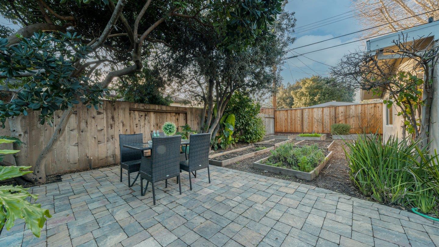 806 Rorke Way Palo Alto, CA 94303 - Photo 36 of 41 a view of a table and chairs in back yard of a house