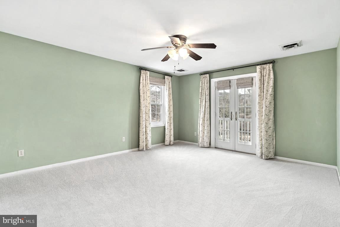 9033 Old Waterloo Road Warrenton, VA 20186 - Photo 27 of 49 Primary Bedroom with Anderson Fr. Doors to Balcony