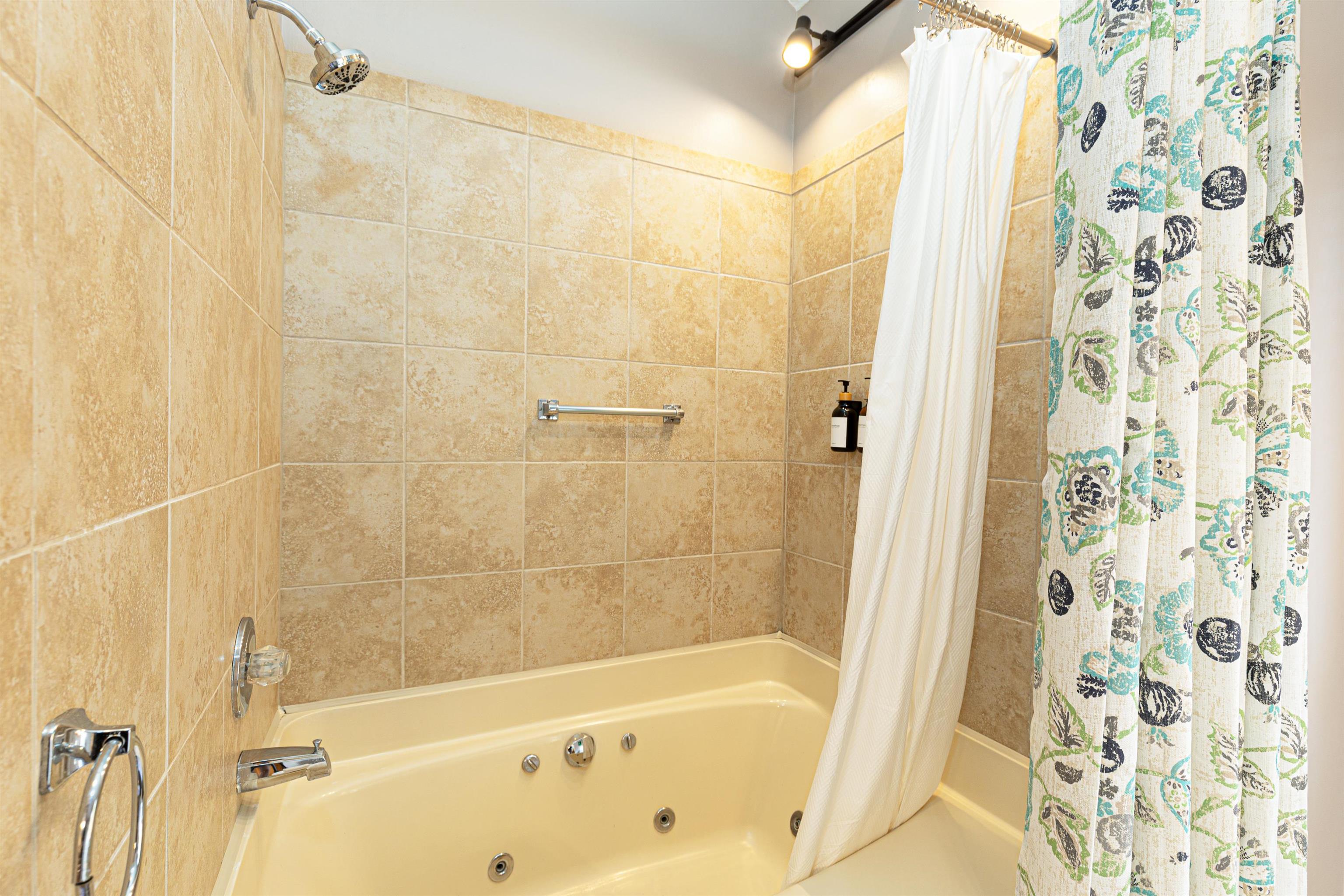 26 Poplar Ridge Galena, IL 61036 - Photo 42 of 55 a bathroom with a bathtub and shower