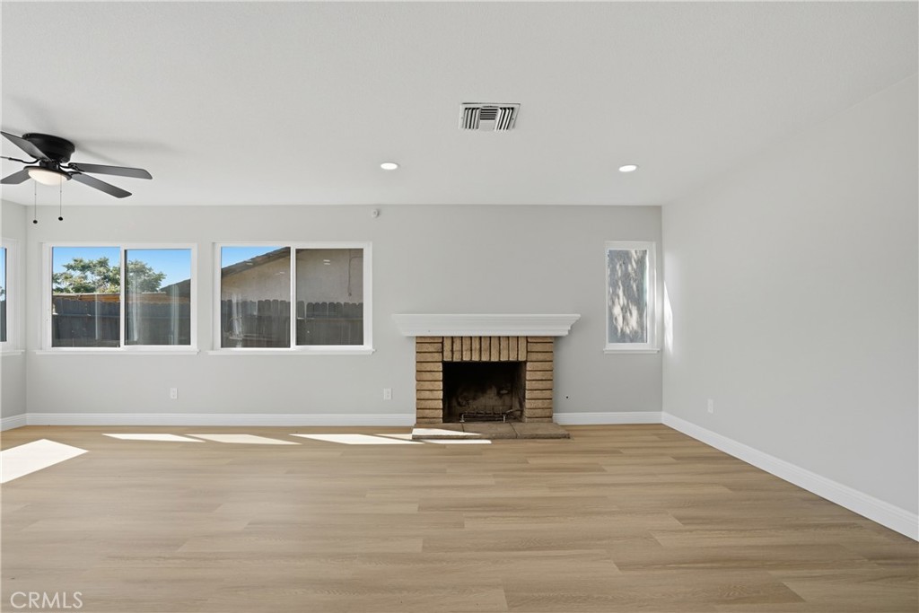 2924 Louisiana Place Riverside, CA 92506 - Photo 10 of 42 a view of an empty room with wooden floor and a window