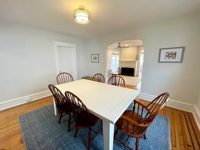 a view of a dining room with furniture and window