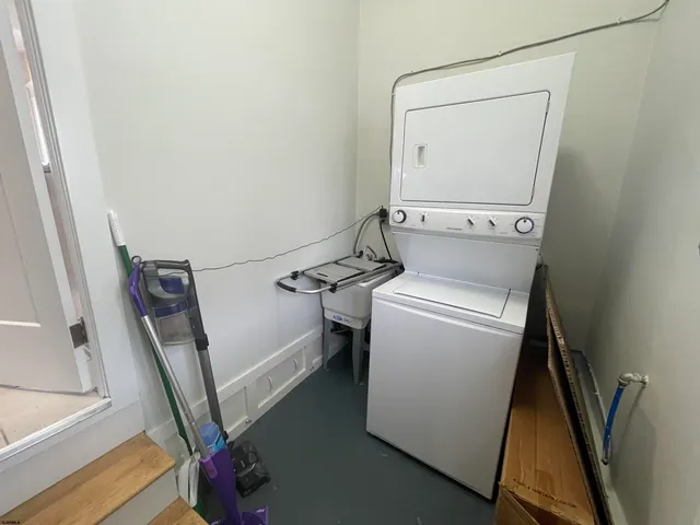 a view of a backyard with a table and chairs