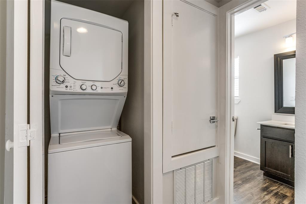 2106 Bennett Avenue, Unit 209 Dallas, TX 75206 - Photo 16 of 22 Stackable laundry unit within a dedicated utility closet