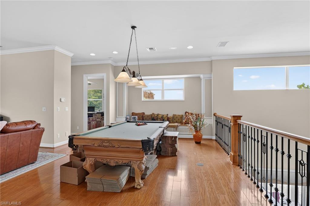 1964 Rialto Way Alva, FL 33920 - Photo 24 of 50 a room with furniture pool table and wooden floor