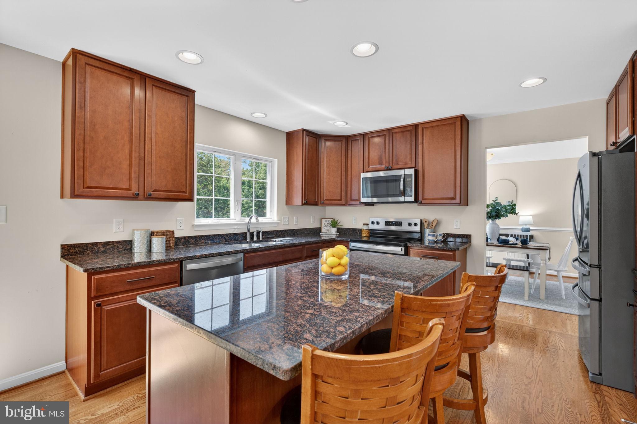 6090 Old Washington Road Elkridge, MD 21075 - Photo 12 of 86 Modern kitchen with rich wood accents.