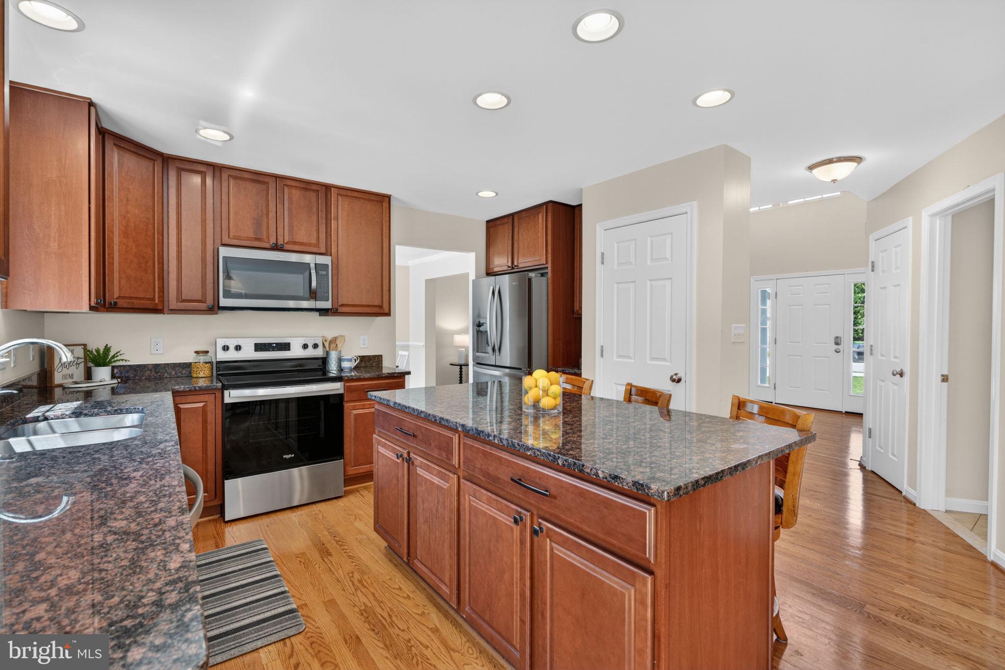 6090 Old Washington Road Elkridge, MD 21075 - Photo 13 of 86 Modern kitchen with rich wood accents.