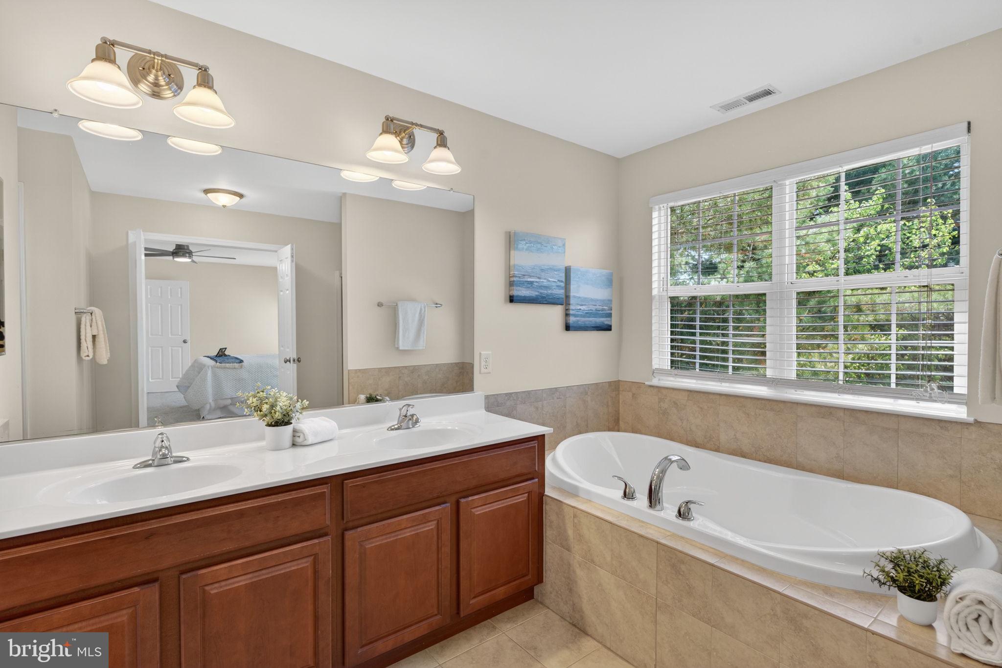 6090 Old Washington Road Elkridge, MD 21075 - Photo 38 of 86 Serene bathroom with natural light.