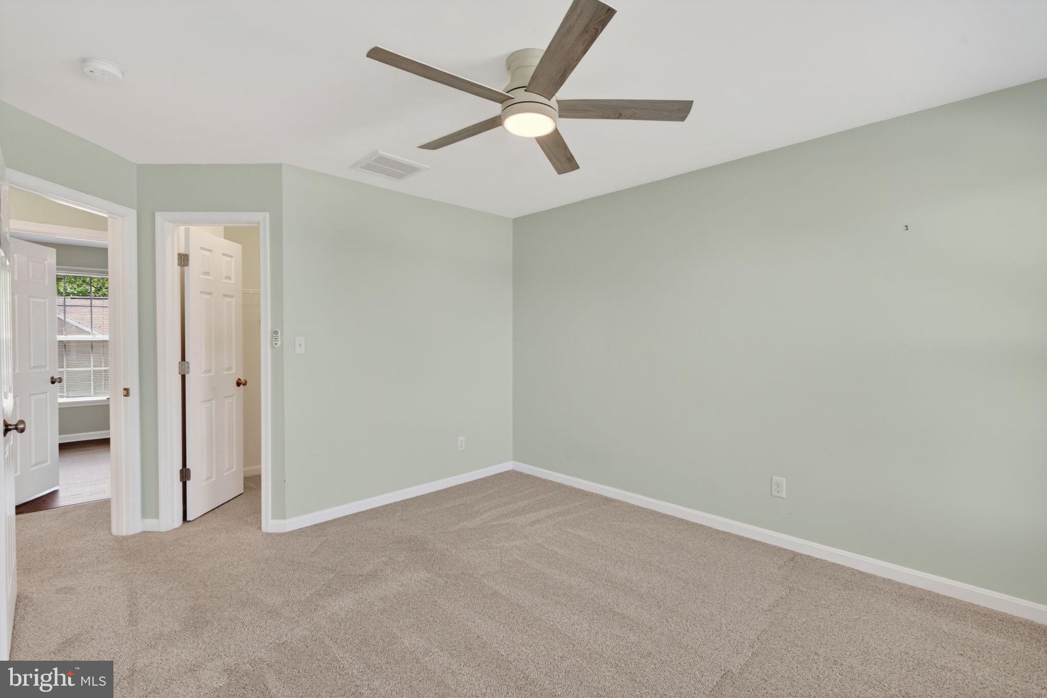 6090 Old Washington Road Elkridge, MD 21075 - Photo 45 of 86 Bright and airy room with modern fan.