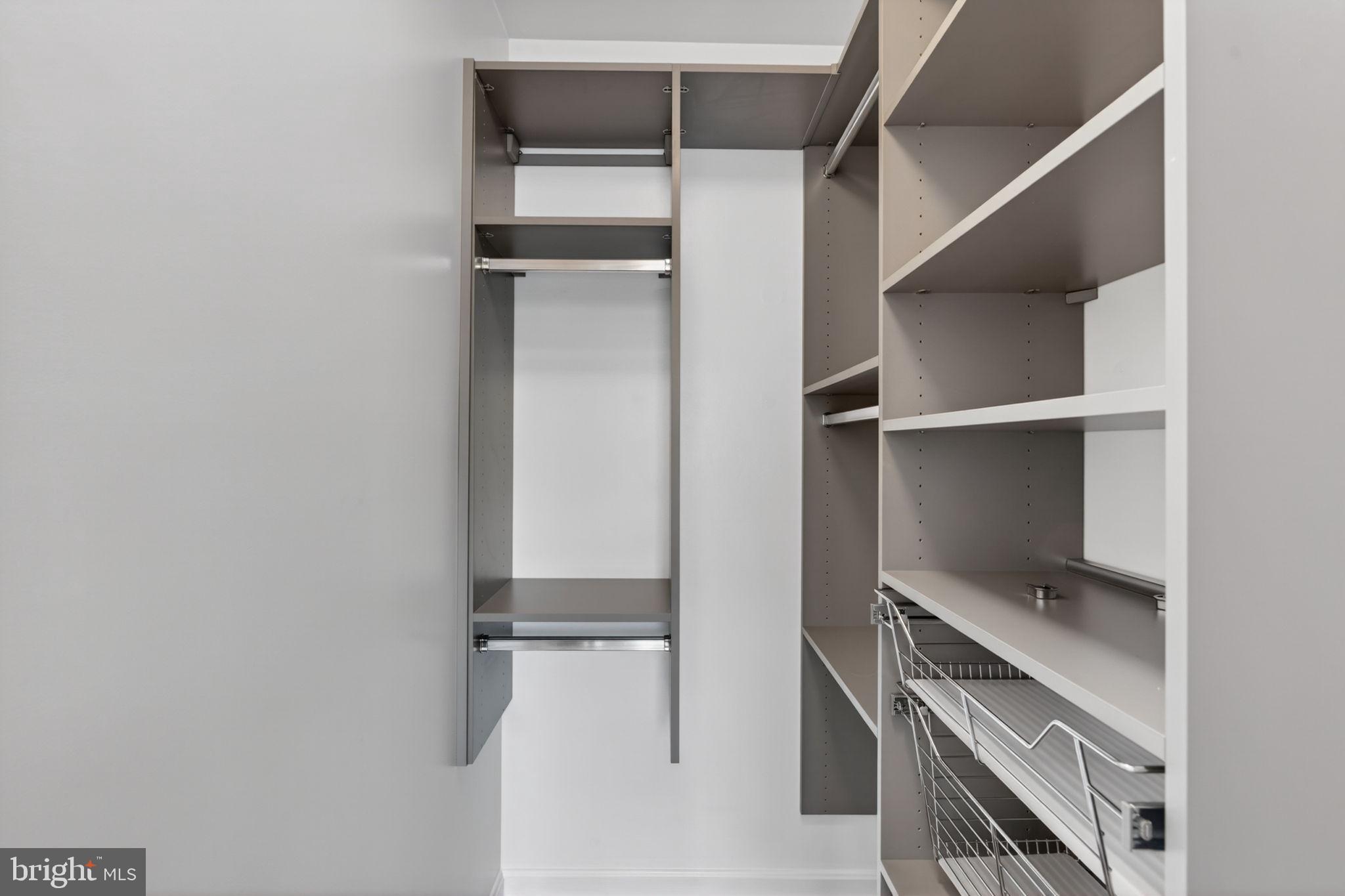 6090 Old Washington Road Elkridge, MD 21075 - Photo 49 of 86 Sleek, modern closet organization space.