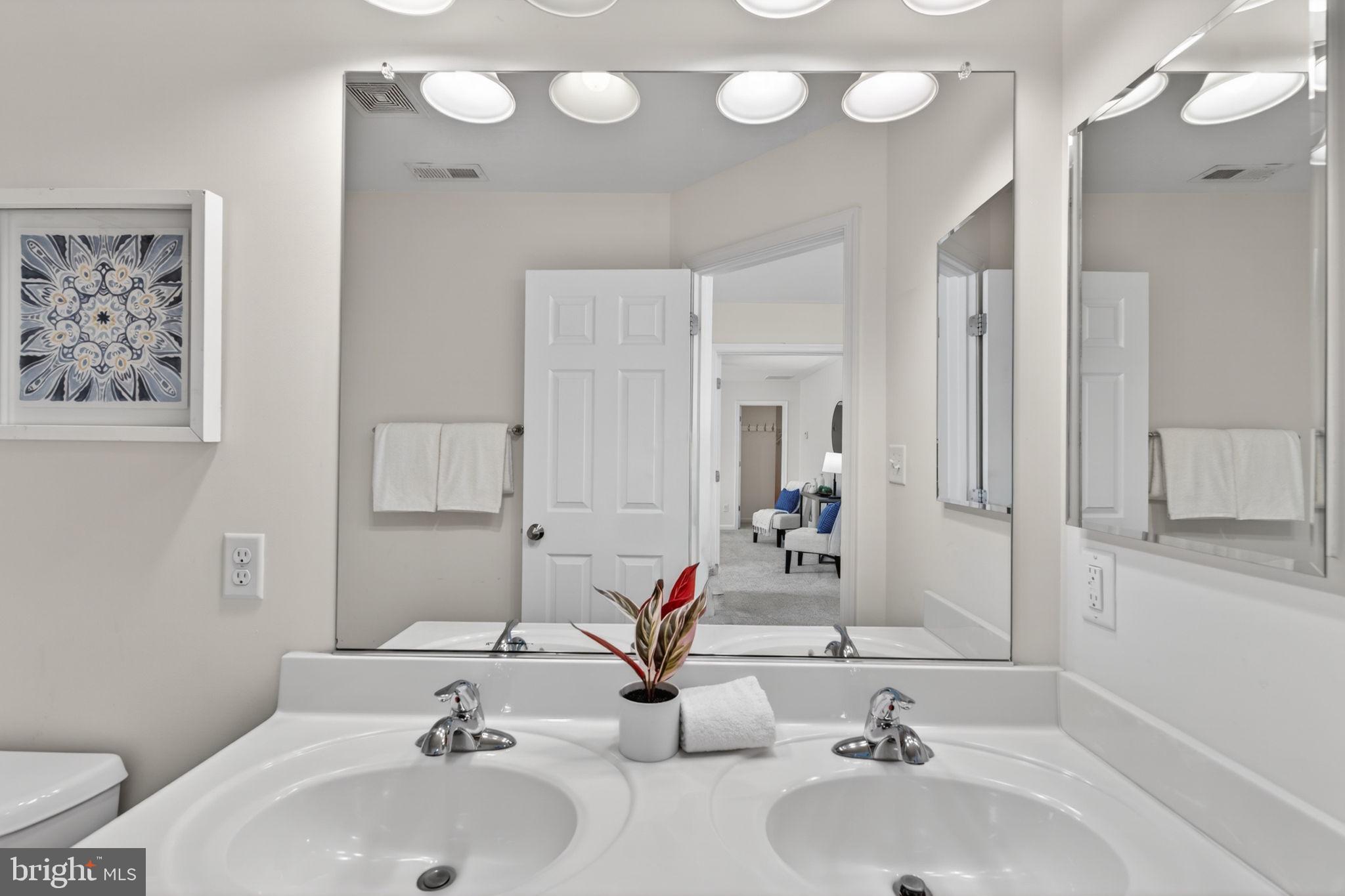 6090 Old Washington Road Elkridge, MD 21075 - Photo 51 of 86 Sleek dual vanity in modern bathroom.