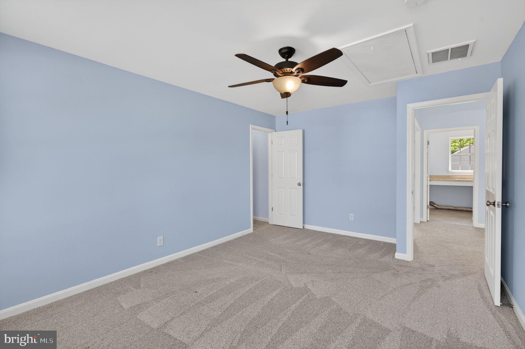 6090 Old Washington Road Elkridge, MD 21075 - Photo 53 of 86 Serene blue room with ceiling fan.