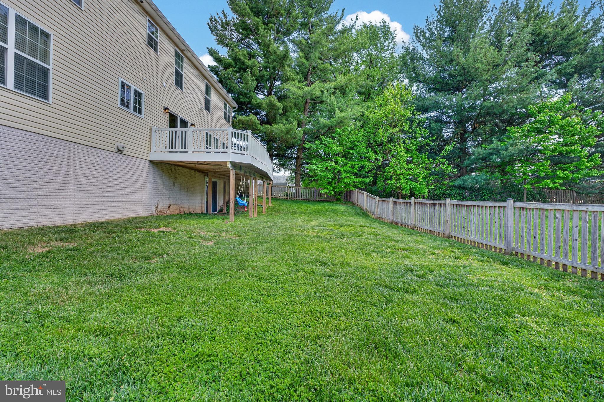6090 Old Washington Road Elkridge, MD 21075 - Photo 67 of 86 Spacious backyard with lush greenery.