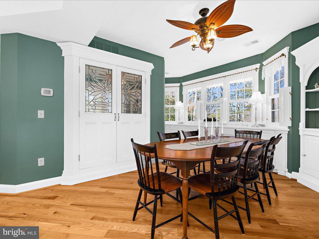 1735 Broadlee Trail Annapolis, MD 21401 - Photo 21 of 65 a view of a dining room with furniture window and wooden floor