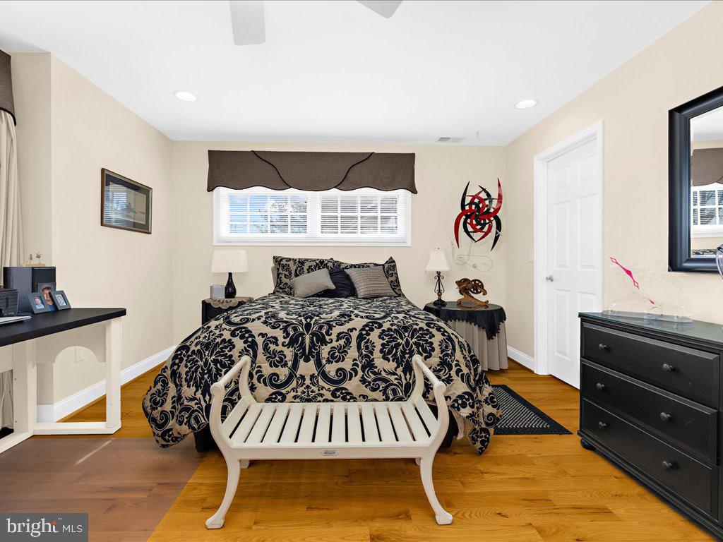 1735 Broadlee Trail Annapolis, MD 21401 - Photo 27 of 65 a bedroom with a bed and dresser