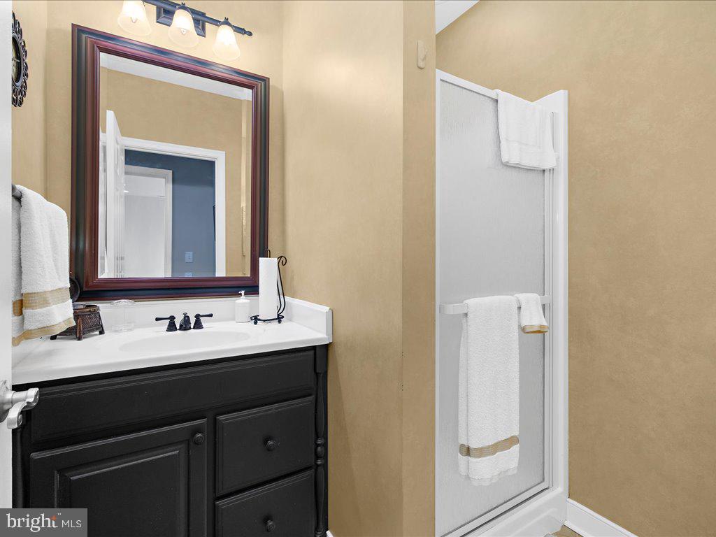 1735 Broadlee Trail Annapolis, MD 21401 - Photo 48 of 65 a bathroom with a sink and a mirror