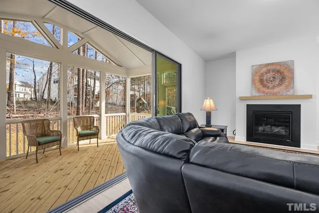a view of a room with wooden floor and furniture