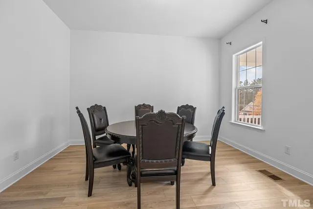 a view of staircase with white walls and a window