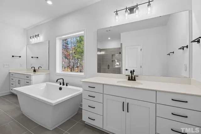 a bedroom with a bed and a view of closet