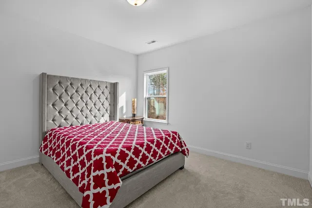 a bathroom with double sink and two mirror