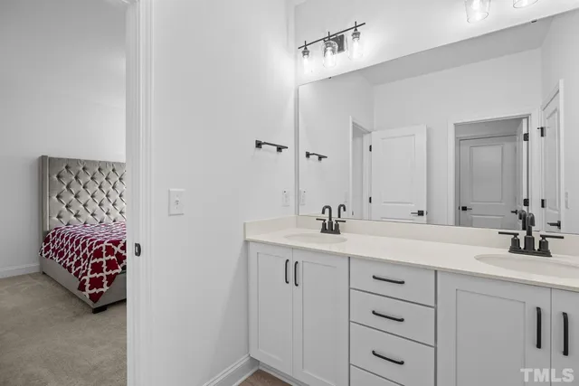 a spacious bedroom with a large bed and a window