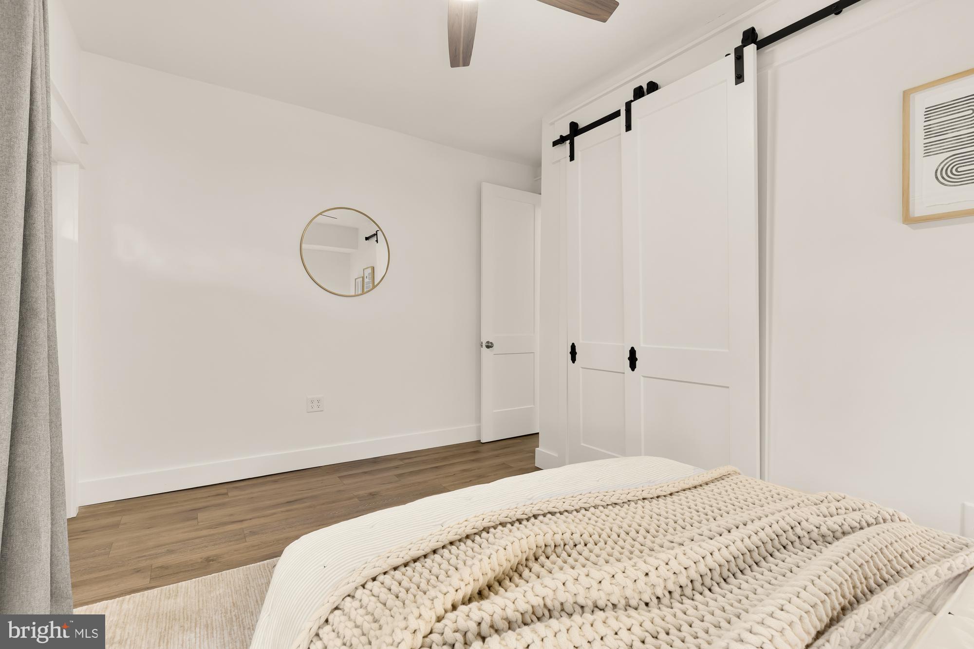 512 U Street Northwest, Unit 3 Washington, DC 20001 - Photo 12 of 26 a bedroom with a large bed and a chandelier