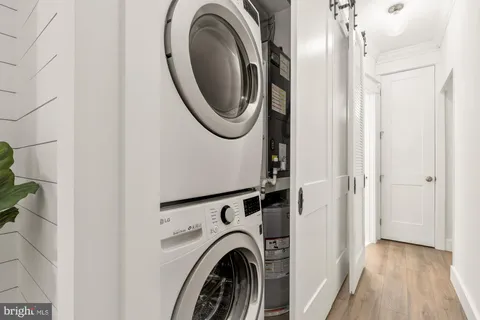 a view of a hallway with washer and dryer