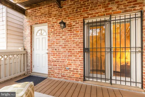 a view of a brick wall with a glass door