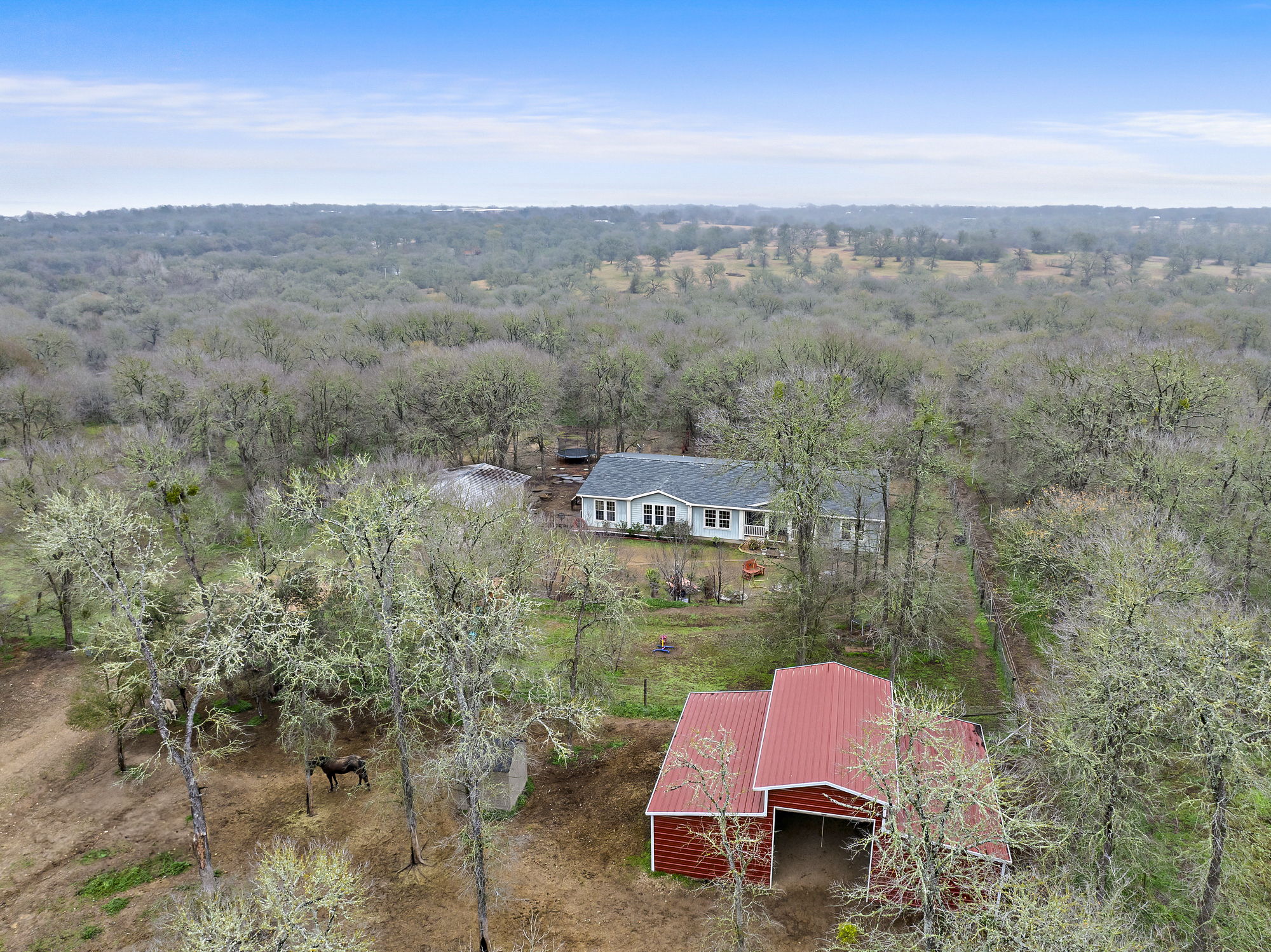 an aerial view of a house with mountain view