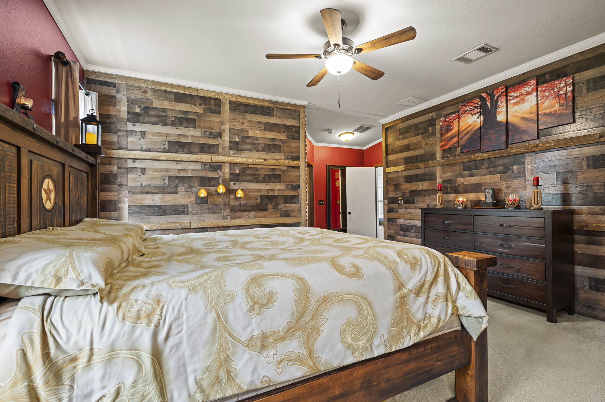175 Fawn Ridge Road Cedar Creek, TX 78612 - Photo 18 of 34 a bedroom with a bed and a chandelier